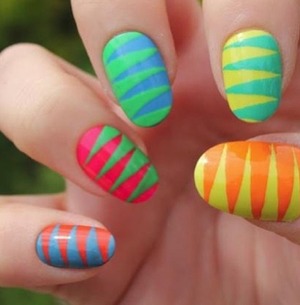 These nails have a zipper pattern with a colorful twist.