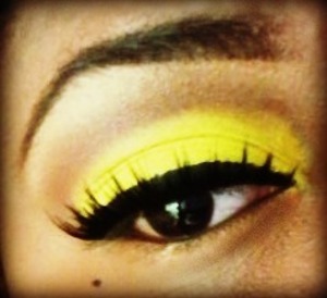 I packed on a bright yellow shadow from my Blush Professional palette. I used a beige shadow under my brows & blended a skin tone matching brown into my crease. . . My eyeliner is MAC's liquid eyeliner & the lashes are by Eyelure. :)