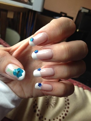 Shellac manicure with petal and gems 