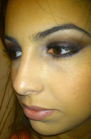Black and brown eyeshadows with red glitter