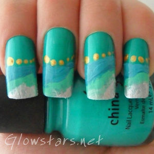 A green, aqua and jade mani created using freehand design with acrylic paint and a dotting tool