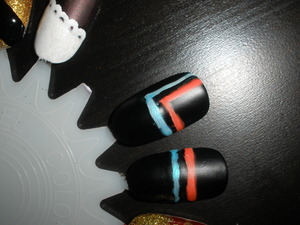 Tron Racing nails. 
Black base, white stripes, majorly bright blue and orange, matte top coat.