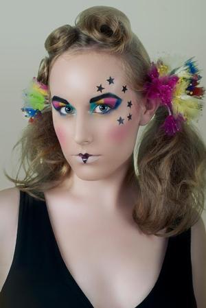 This looks was inspired by clowns, mimes and court jesters. The colorful eyes and stars were done with Makeup Forever Flash Pallet and set with HD Microfinish Powder. 
Model: Logan R
Photographer: Rebecca M