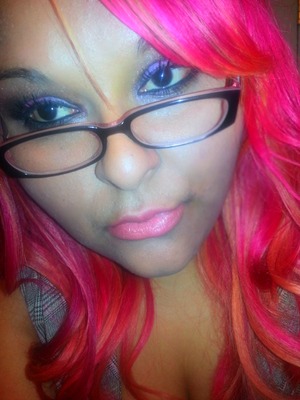 pink hair light pink lips and a pink purple smokey eye