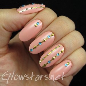 Read the blog post at http://glowstars.net/lacquer-obsession/2014/12/striping-tape-rhinestones-and-studs/