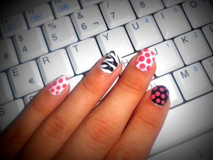 I made this cute style with white, black and pink polish .
I used dotting tool for making the dots and the zebra style.
I hope you enjoy ;)