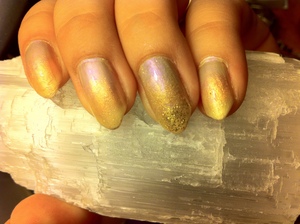 I did an iridescent gold to lavender fade on a Stiletto nail. I wish i could've gotten a better picture, this picture doesn't do it justice.  