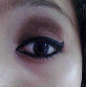 this is how I do my make up I use some Black Maybelen Gel Eyeliner and Brown and White eye shadow and I put the eyeliner first so I could get the wing perfect then I apply the brown eye shadow then the white on top to bring out the brown but yea that's how I do it 