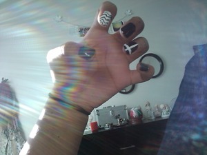 A cross on my ring finger, zig-zags on my pointer, and glitter on my pinky...

