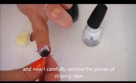 Orange, black and white striped sponging nail art