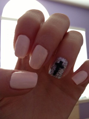Sheer pink glitter accent nail with a black cross super cutee!!