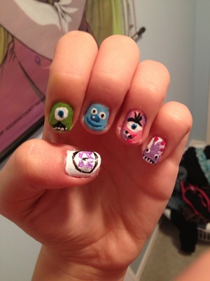 Going to see monsters university tomorrow so I thought I'd do monsters inc themed nails.  On my thumb is the monsters inc logo then mike, followed by sully, I forget her name but the next one is mikes GF and then randof. 