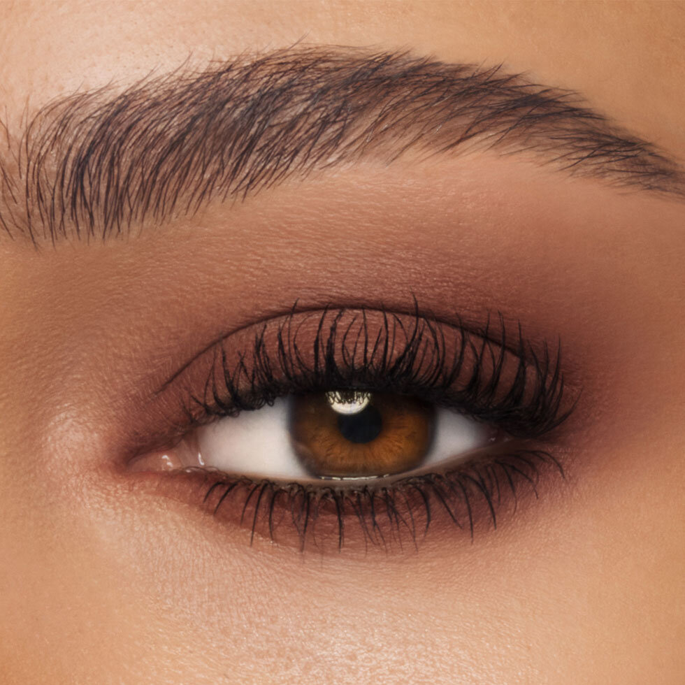Charlotte Tilbury model wearing the Exagger-Eyes Waterproof Eyeshadow Stick in Chestnut Sculpt