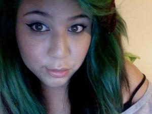 A cat eye with soft pink cheeks and light foundation.