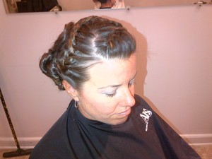 The braid rounds around the top and incorporates the front right section of hair, then ties into the twisted bun in the right back. http://beautybylindsay.blogspot.com/2012/05/derbylicious-updo-tips.html