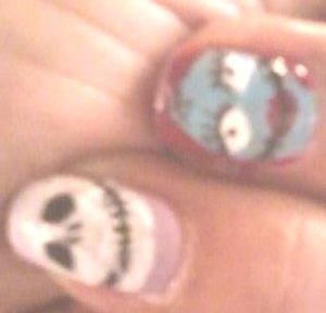 Nightmare Before Christmas. I used Sally Hansen Nail Art Pen in black and white, SinfulColors Nail Art in Be My Valentine, Nail Base and Nail Art Diva Top Coat.