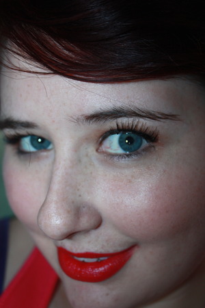 Red lips with a natural eye look with some fake lashes.