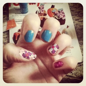 Tried something different by color blocking using nail stickers, blue nail polish, and make the pinky have pink glitter.