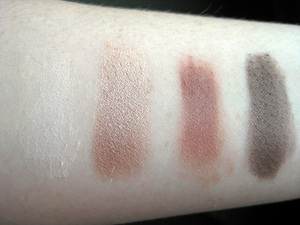 Swatches of Clinique's Colour Surge Eye Shadow Quad in Black Honey. The highlight color hardly shows up on my skin.