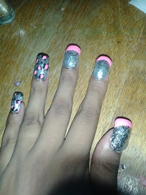 Silver confetti polish with hot pink leopard print and not pink French tips. ?