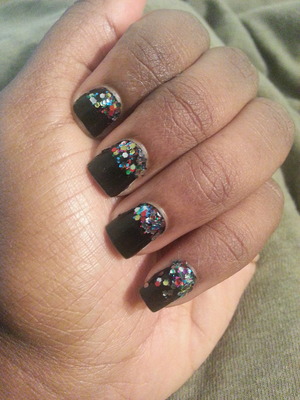 Black base with a glitter polish ombre-type effect.