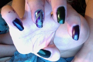 deep purple and green with marbling of both colors on the ring finger