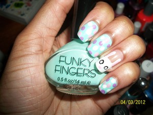 This is too cute! Sooo many people like this design . I used Funky Fingers/ Mint as the base and i use Essie/ Playdate, China Glaze/ White on White and L'Oreal/ Trust Fund Baby for the dots . I did a simple  clear coat as a base on my accent nail and i did the bunny with China Glaze/ White on White and i used L'Oreal/ Trust Fund Baby for the nose and the inside of the ears .