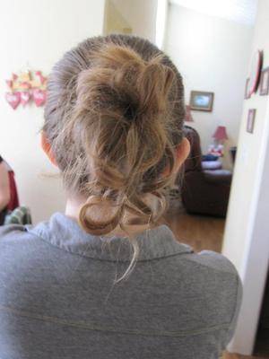 My sister's friend did my hair. She put my hair into a bun, then pulled pieces out of it. She curled them and sprayed it with a ton of hairspray. My friends and I all loved it! 