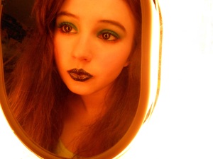 Black lipstick with blue sparkles, blue eyeshadow with salmon eyeliner. Fun for a rave ;p