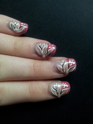 Nail art I did the other day :) 
Credit to youtube "Tartofraises Nail Art" and her video "Un nail art fleuri sur une french manucure" from which this nail art was inspired! Check out the link:

http://www.youtube.com/watch?v=esKF2BA61SI&list=UUDhYH6gY5rd2K_QaZ7plxZQ&index=1&feature=plcp