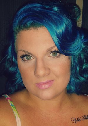 This hair color was achieved by pre lighting hair then using ion color brilliance in teal.