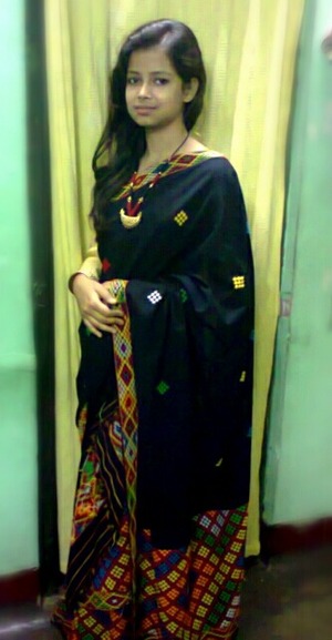 Black and gold :) Its called mekhela-chadar..Two parted saree...Mekhela the bottom cloth and chadar the upper cloth..Blouse- golden.. With assamese traditional jewellary :)