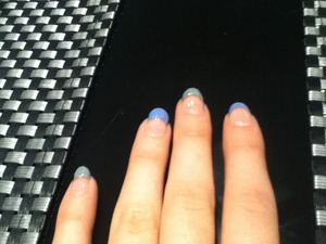 Blue and grey nail varnish