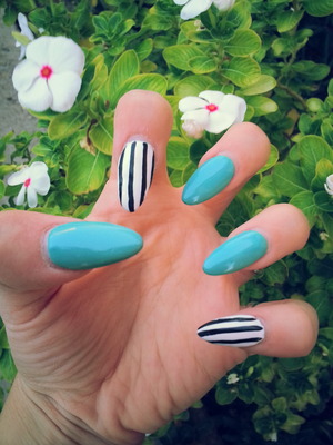 TEAL NAILS POLISH PAINTED OVER ACRYLIC NAILS W/ WHITE NAILS AND BLK STRIPES
