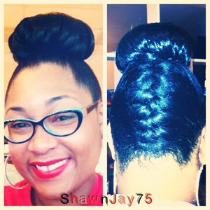 High bun with French braid in the back.  