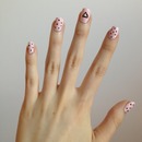 pink polka-dot triangle nails