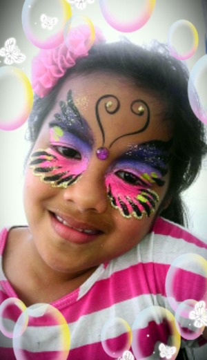 My pretty mama gurl with pink and purple Face paint Butterfly.