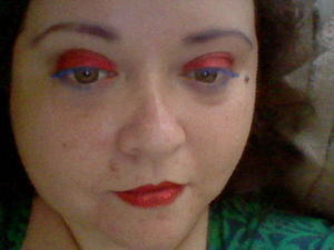 I used this combo when I went to Comic Con 2012 for a Superman-inspired look.  I used Manic Panic Glamnation Glitter Jewels in "Ruby Slippers" on my eyelids and lips (with Medusa's Makeup "Stick It" to keep it in place).  I then used Medusa's Makeup mascara in blue on my top and lower lashes.  I also used Medusa's Makeup mascara in purple on my eyebrows, but you can't really see it in the pic.