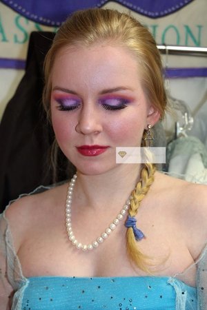 Would you like to be elsa from Frozen? My beautiful friend models how easy it is to get this colorful look. Simply blend a lilac shadow across your mobile lid. Next, blend in a darker purple on your outer v, and a smaller bit on the inner corner. Connect the two by carving out the crease with the same dark purple. Use a deep fuchsia pink to blend out the deep crease, take your time to blend, blend blend! Now soften the edges of the pink with a bright orange to finish those Disney eyes! Use a blush that mimics a cold weather flush, and creat a chilled lip look with a berry gloss. Don't be afraid to highlight and add a frosty sheen to your skin, use shimmering eyeshadows on the high points of your face. Hope this helps, and have fun!