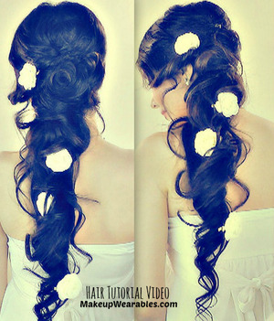 Princess hair inspired,  cascading, side-swept curls, long hairstyle for wedding, homecoming, or prom.

Step-by-step,  hair tutorial video here - http://www.makeupwearables.com/2013/07/hair-tutorial-video-cascading-messy.html
