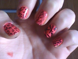 neon pink nails with leopard print but zebra print on my ring finger done by me 