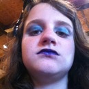  i am wearing a color stain eyeshadow in sea-foam by Mabelline. Also with purple lipstick from: Black-Heart Beauty at Hot Topic