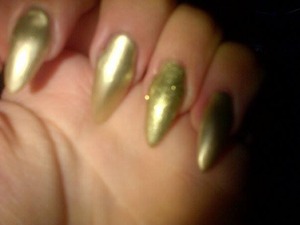 my friends sister did my nails for me they were a tad long but i filed them down and added one gold stud to the ring fingers at the tip but I do not have a picture