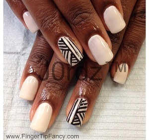 http://fingertipfancy.com/black-white-tribal-nails