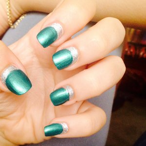 Inverse French with emerald polish and silver glitter. 