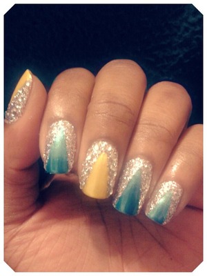 Deep blue and yellow triangle tips with glitter and rhinestones!