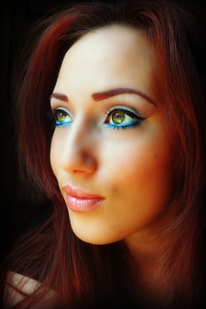 Natural eye makeup with a pop of blues on waterline and lower lash like