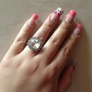 hello kitty nails with polka dots 