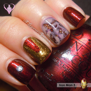Iron Man 3 inspired mani featuring his Arc reactor, mask, and Pepper Potts.
More details on the polishes used, techniques and photos on the blog: http://www.alacqueredaffair.com/Iron-Man-3-Inspired-Mani-29965605
