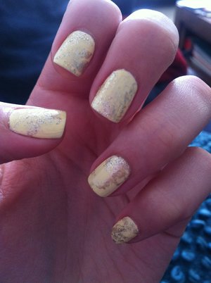 Experimenting with silver glitter(Opi 'Up front and personal') on yellow using plastic wrap.